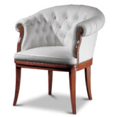 White leather armchair with a curved back and buttoned upholstery, resting on a wooden base with solid wood legs.