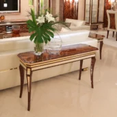 Image of a luxury office waiting area featuring Italian-made burgundy leather sofa and armchair.